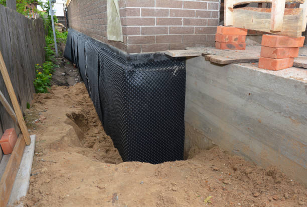 Happy homeowners after waterproofing job in Markle